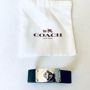 Coach black leather cuff bracelet with shiny silver tone metal turnlock